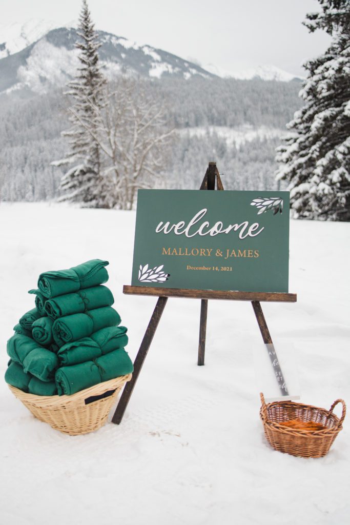 welcome sign for winter wedding in Banff, with blankets to keep guests warm